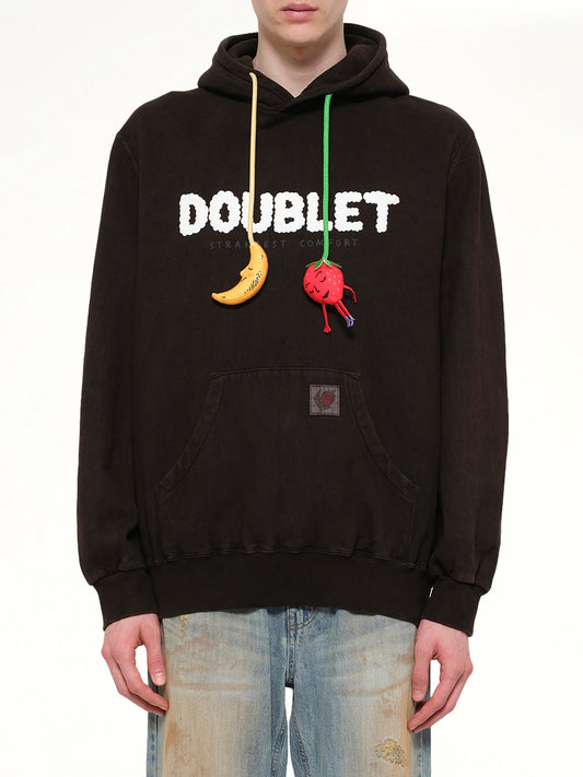 Image of a model wearing Outerwear. Product name - Mud-Dyed Hoodie With SHFU in Brown colour by brand - DOUBLET
