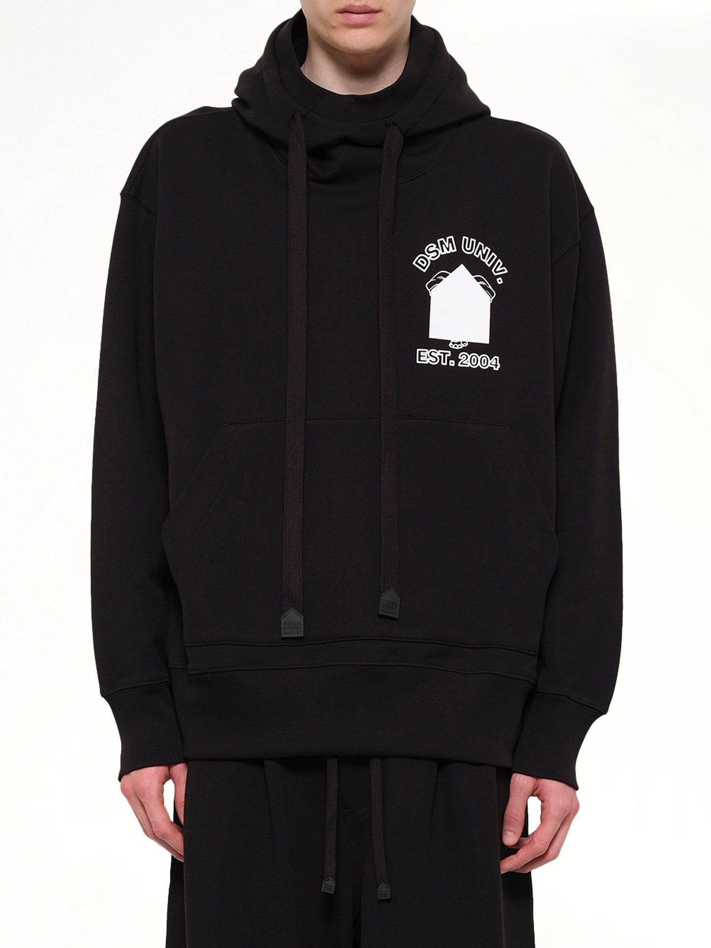 Image of a model wearing Outerwear. Product name - Pile Knit Oversized Hoodie in Black colour by brand - DSM KEI NINOMIYA
