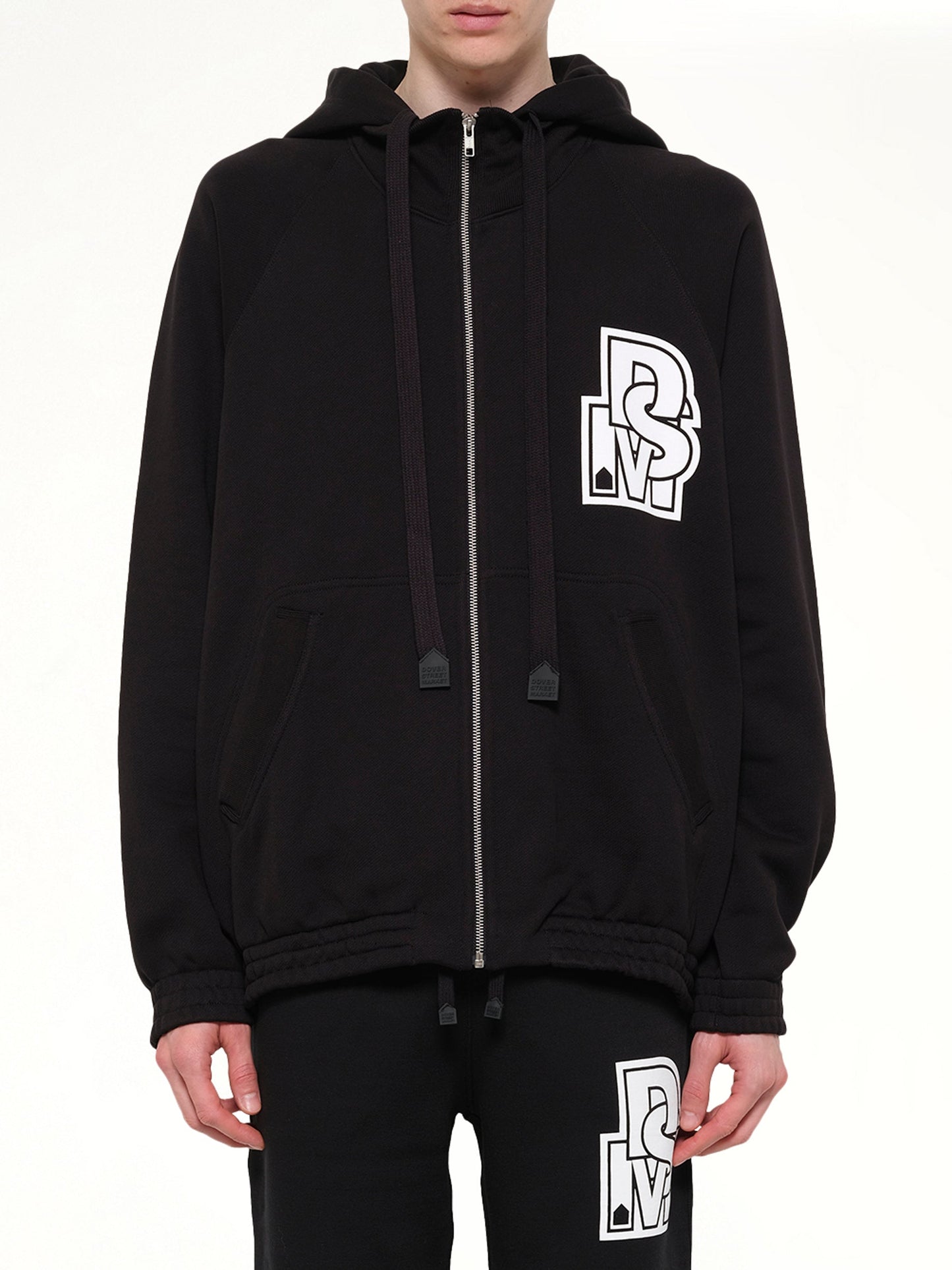Image of a model wearing Outerwear. Product name - Pile Knit Zipped Hoodie in Black colour by brand - DSM KEI NINOMIYA