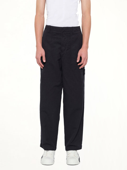 Image of a model wearing Pants. Product name - 3100016 Trousers in Navy colour by brand - STONE ISLAND