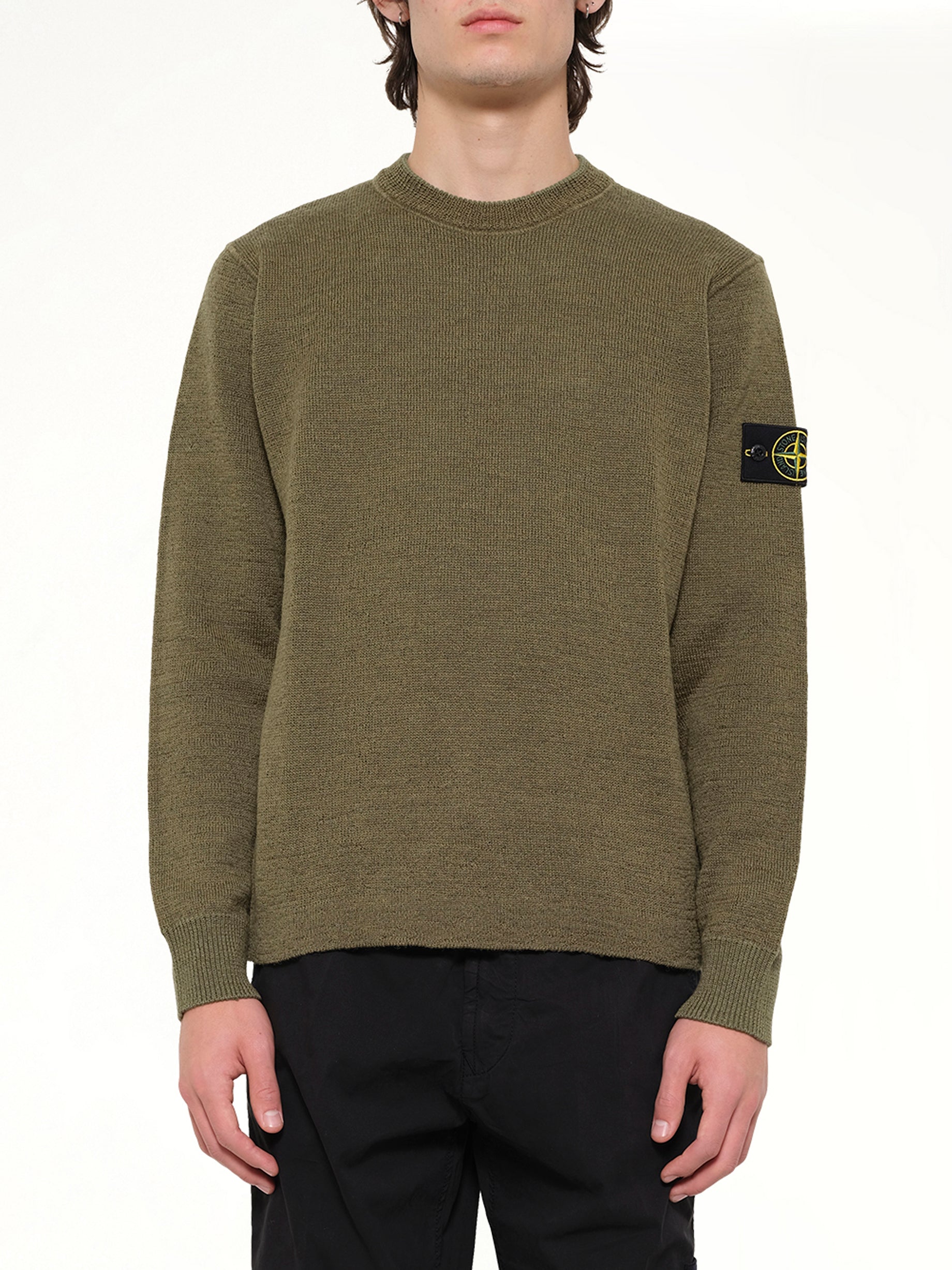Image of a model wearing Outerwear. Product name - 5100015 Crew Neck in Green colour by brand - STONE ISLAND