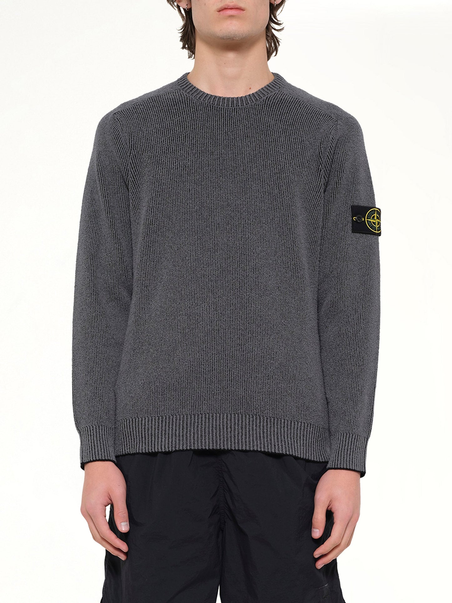 Image of a model wearing Outerwear. Product name - 5100033 Crew Neck in Grey colour by brand - STONE ISLAND