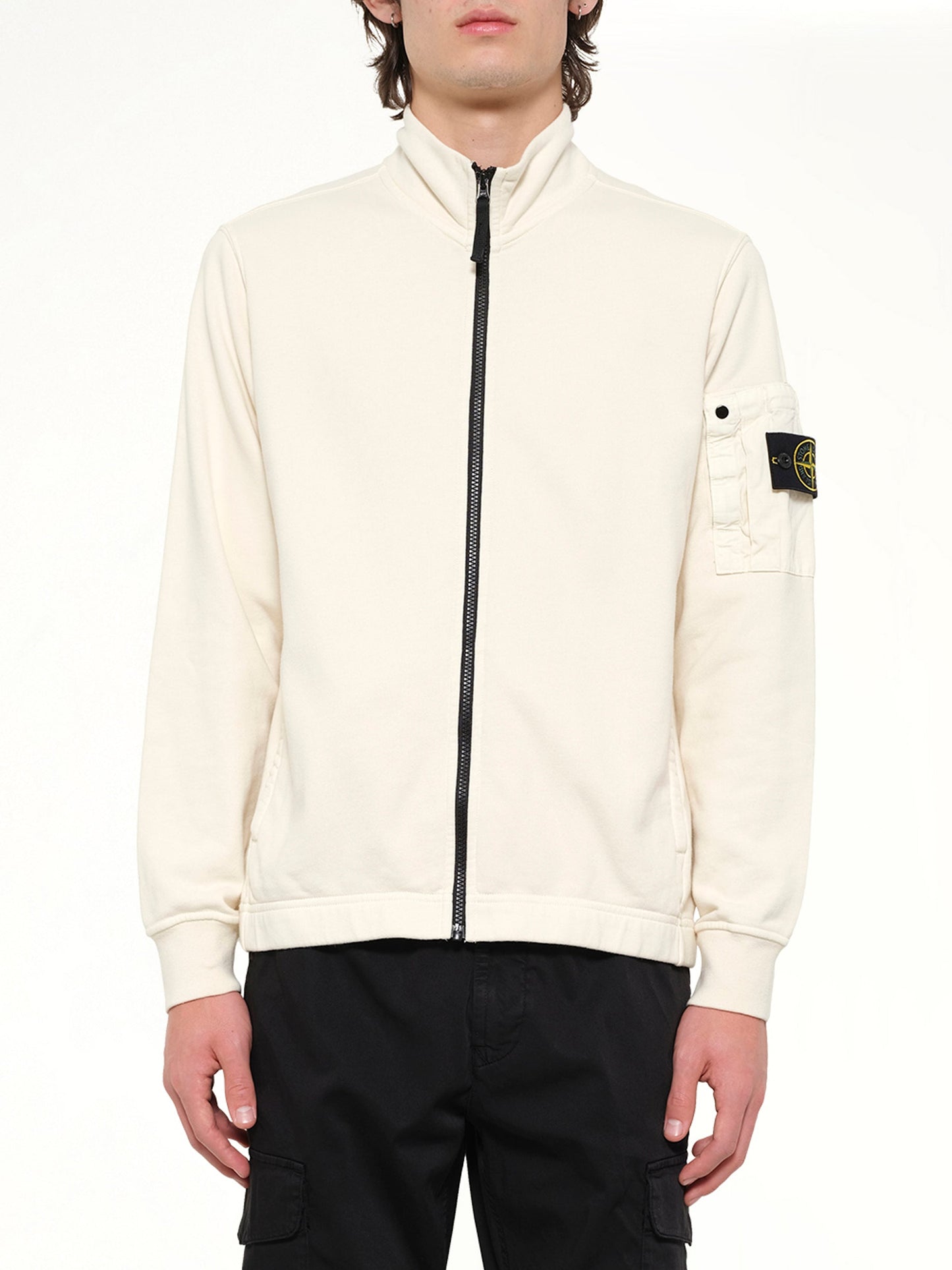 Image of a model wearing Outerwear. Product name - 6100018 Zip Up Cardigan in White colour by brand - STONE ISLAND
