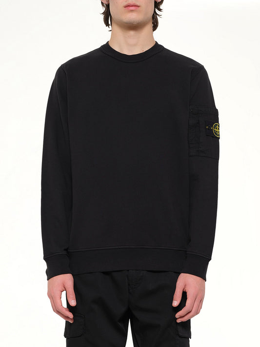 Image of a model wearing Outerwear. Product name - 6100019 Sweatshirt in Black colour by brand - STONE ISLAND