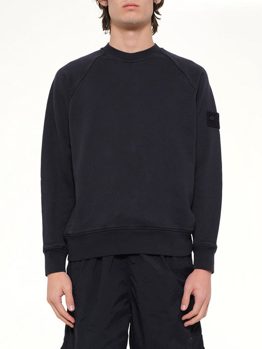 Image of a model wearing Outerwear. Product name - 6100028 Sweatshirt in Navy colour by brand - STONE ISLAND