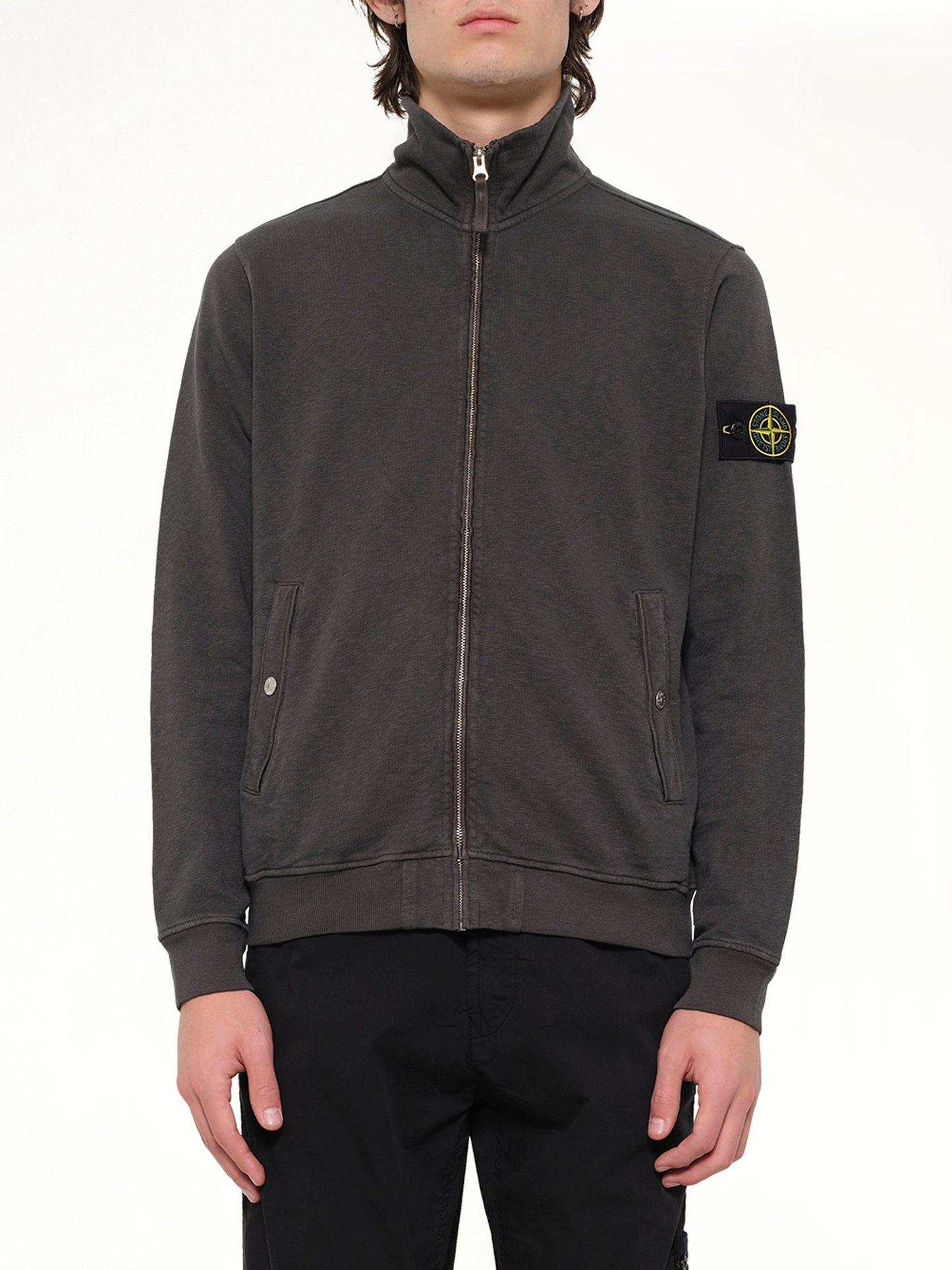 Image of a model wearing Outerwear. Product name - 6100033 Zip Up Cardigan in Grey colour by brand - STONE ISLAND