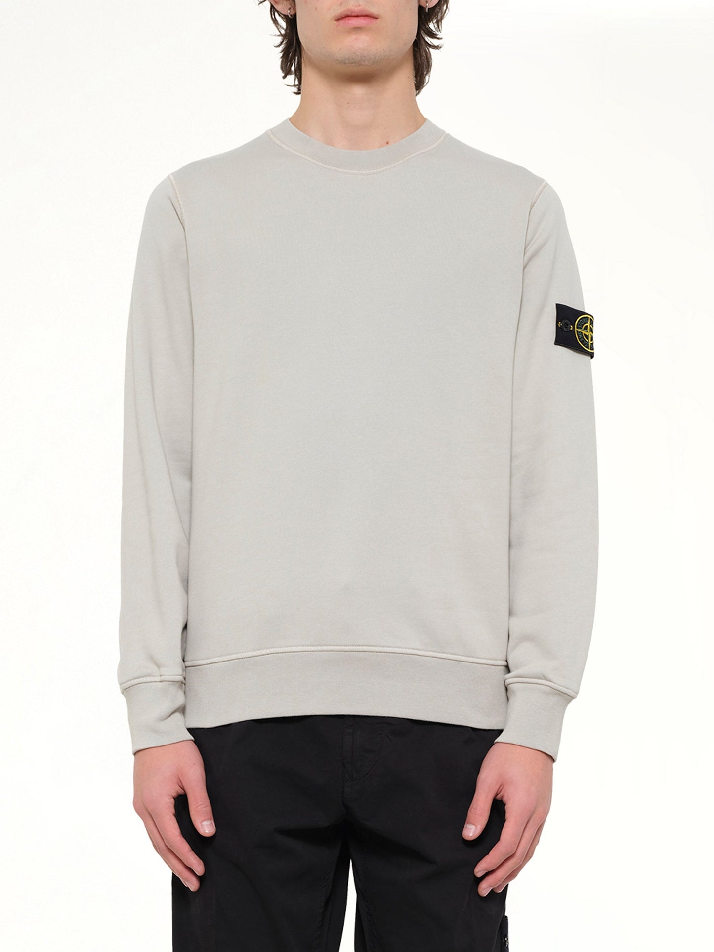 Image of a model wearing Outerwear. Product name - 6100060 Sweatshirt in Grey colour by brand - STONE ISLAND