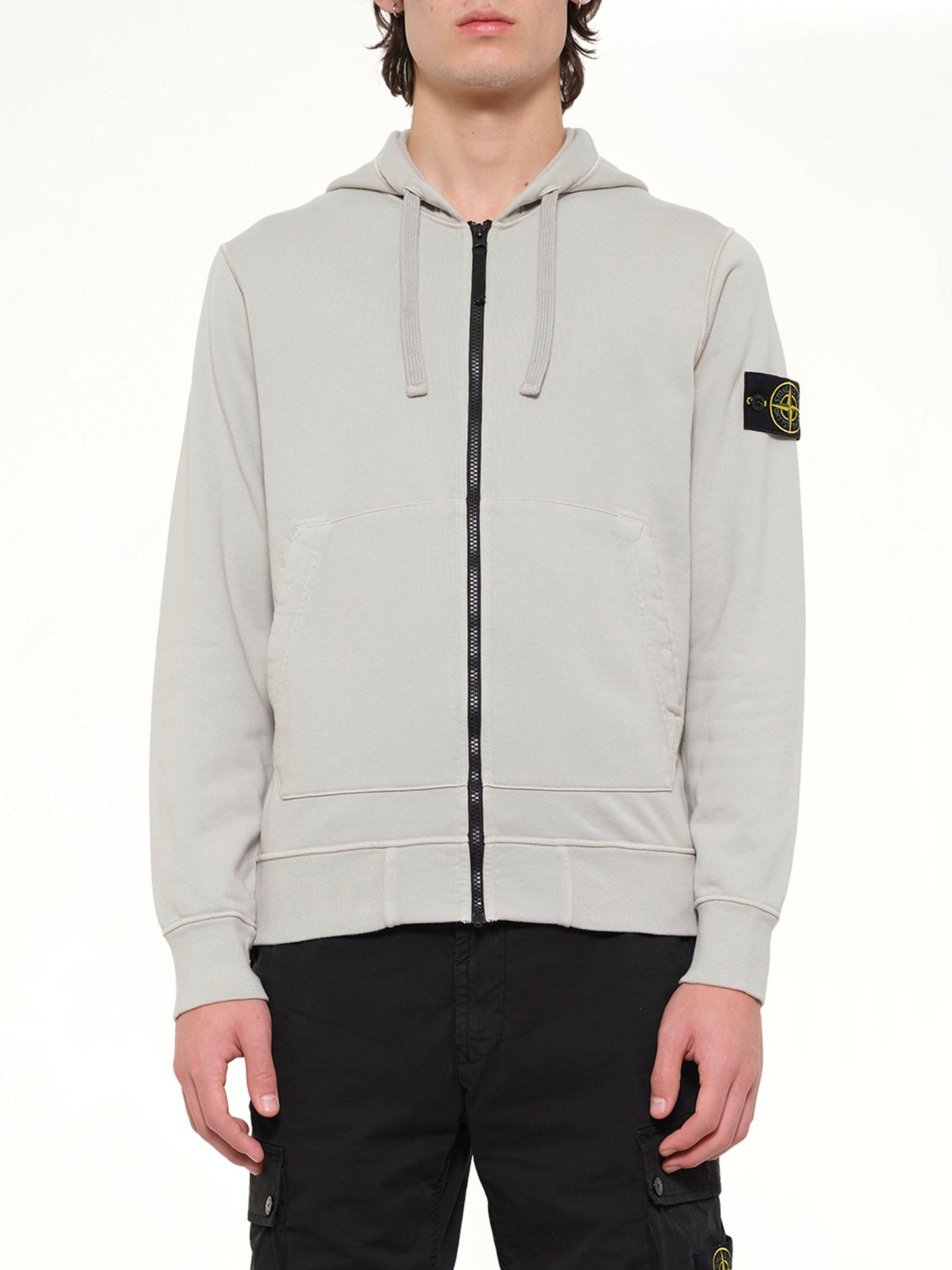 Image of a model wearing Outerwear. Product name - 6100061 Hoodie Sweater in Grey colour by brand - STONE ISLAND