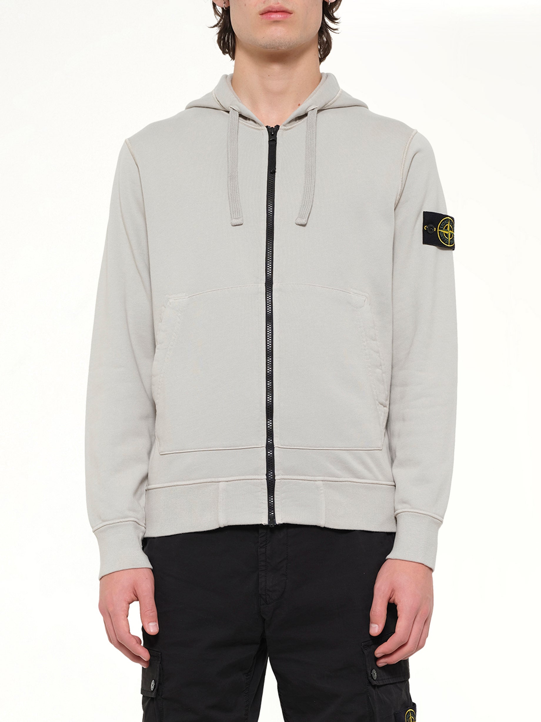 Image of a model wearing Outerwear. Product name - 6100061 Hoodie Sweater in Grey colour by brand - STONE ISLAND