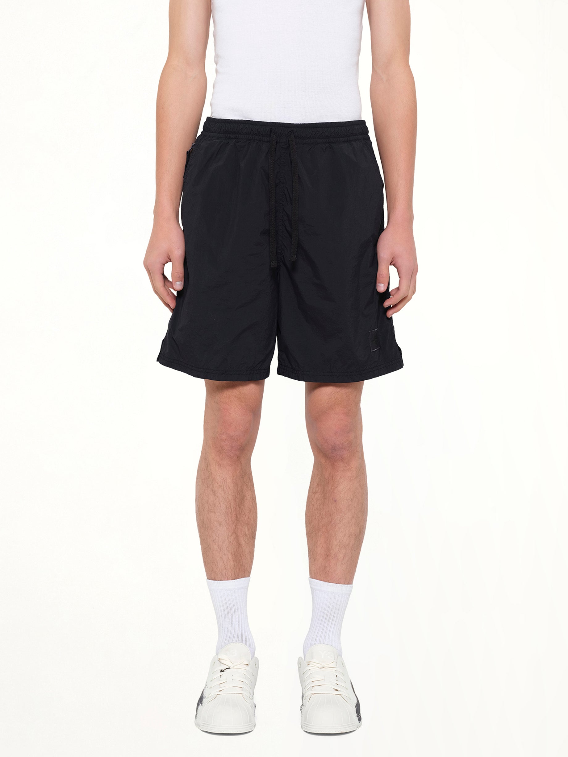 Image of a model wearing Shorts. Product name - B100006 Shorts in Navy colour by brand - STONE ISLAND