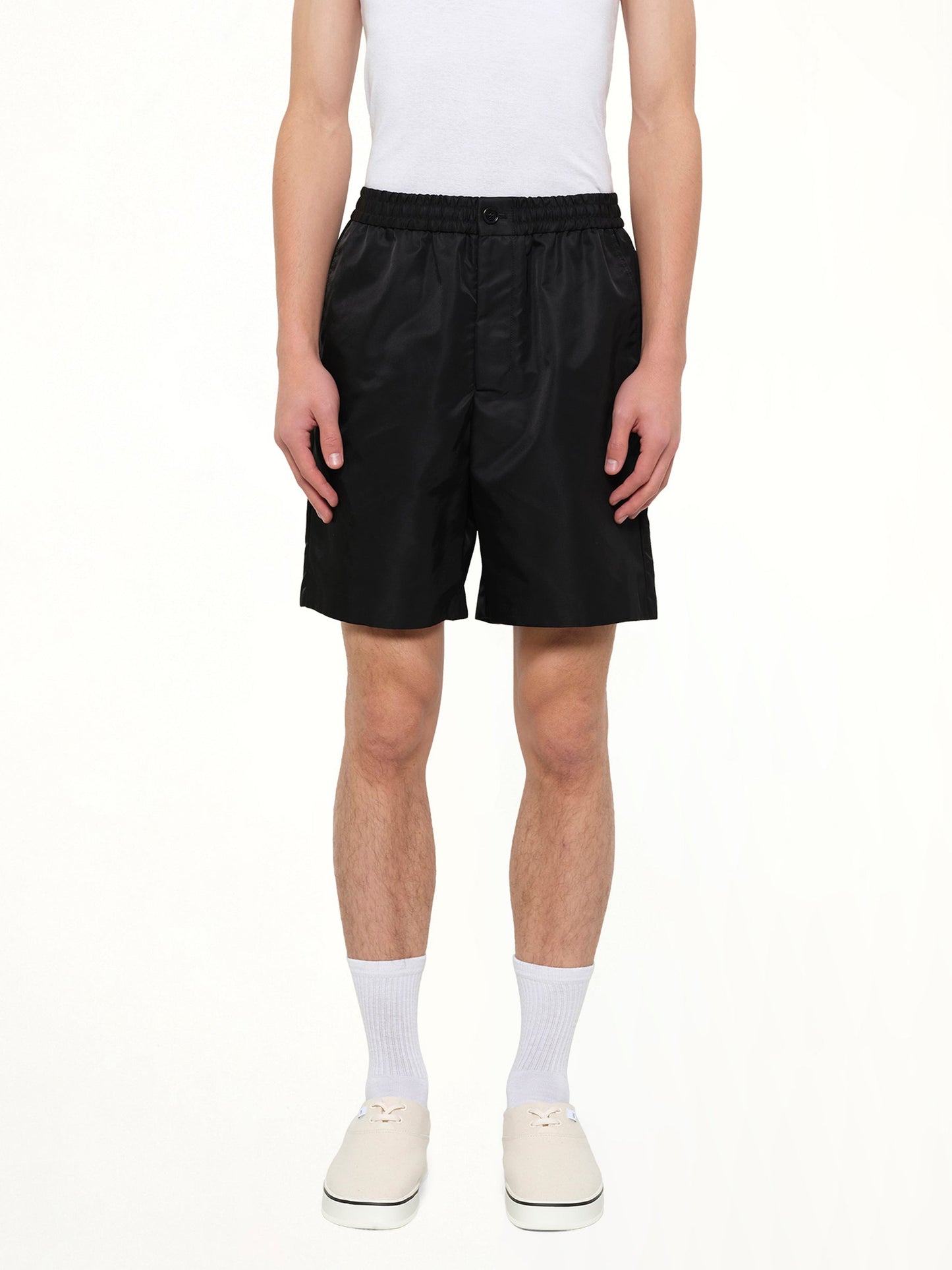 Image of a model wearing Shorts. Product name - Ami De Coeur Stud Shorts in Black colour by brand - AMI PARIS
