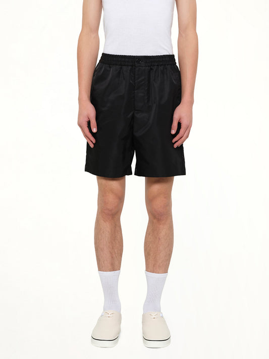 Image of a model wearing Shorts. Product name - Ami De Coeur Stud Shorts in Black colour by brand - AMI PARIS