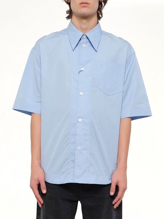 Image of a model wearing Tops. Product name - Camp Collar Short Sleeve Shirt in Blue colour by brand - AMI PARIS