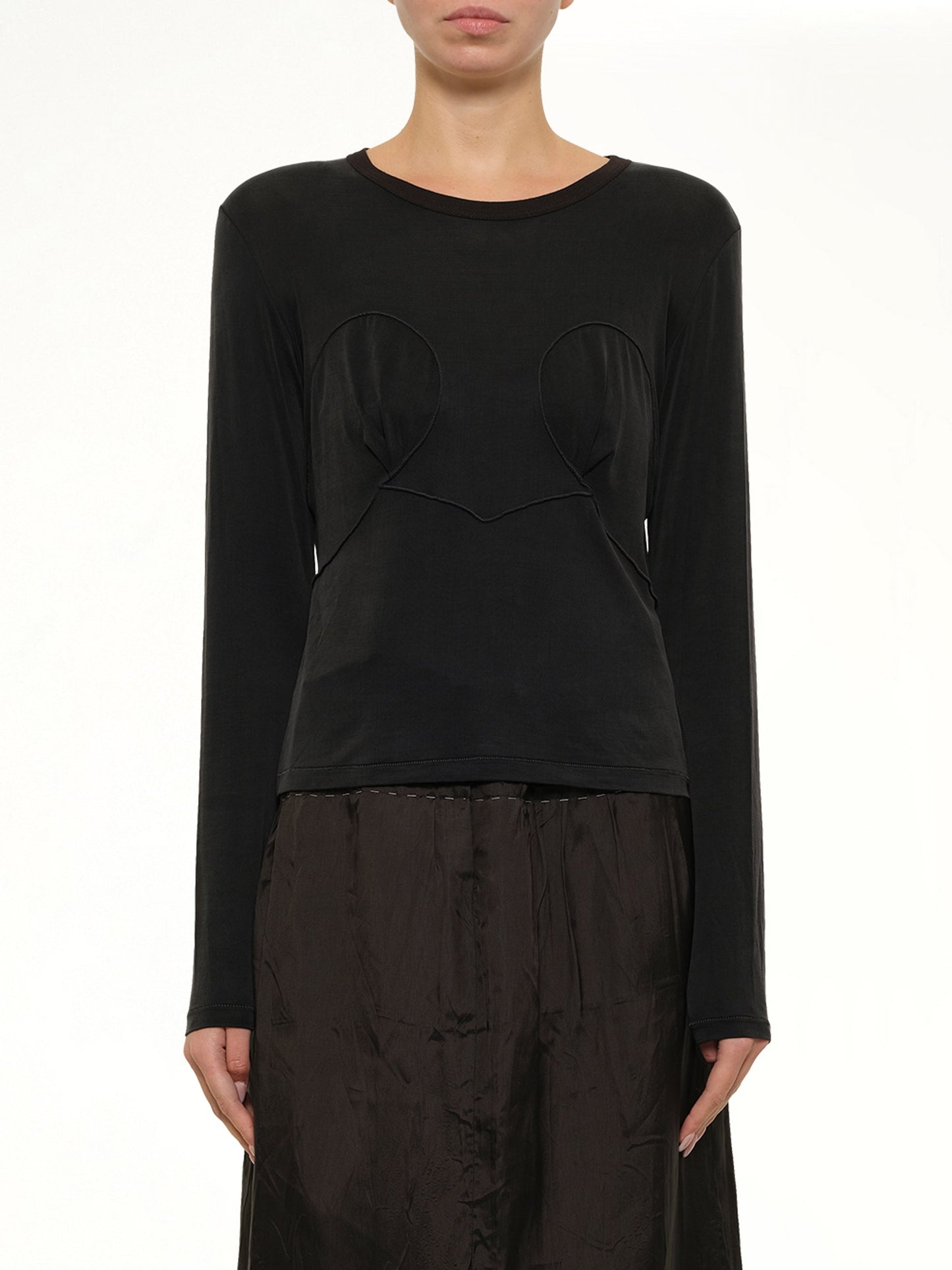Image of a model wearing Tops. Product name - Cut-out Long Sleeve T-Shirt in Black colour by brand - MAISON MARGIELA