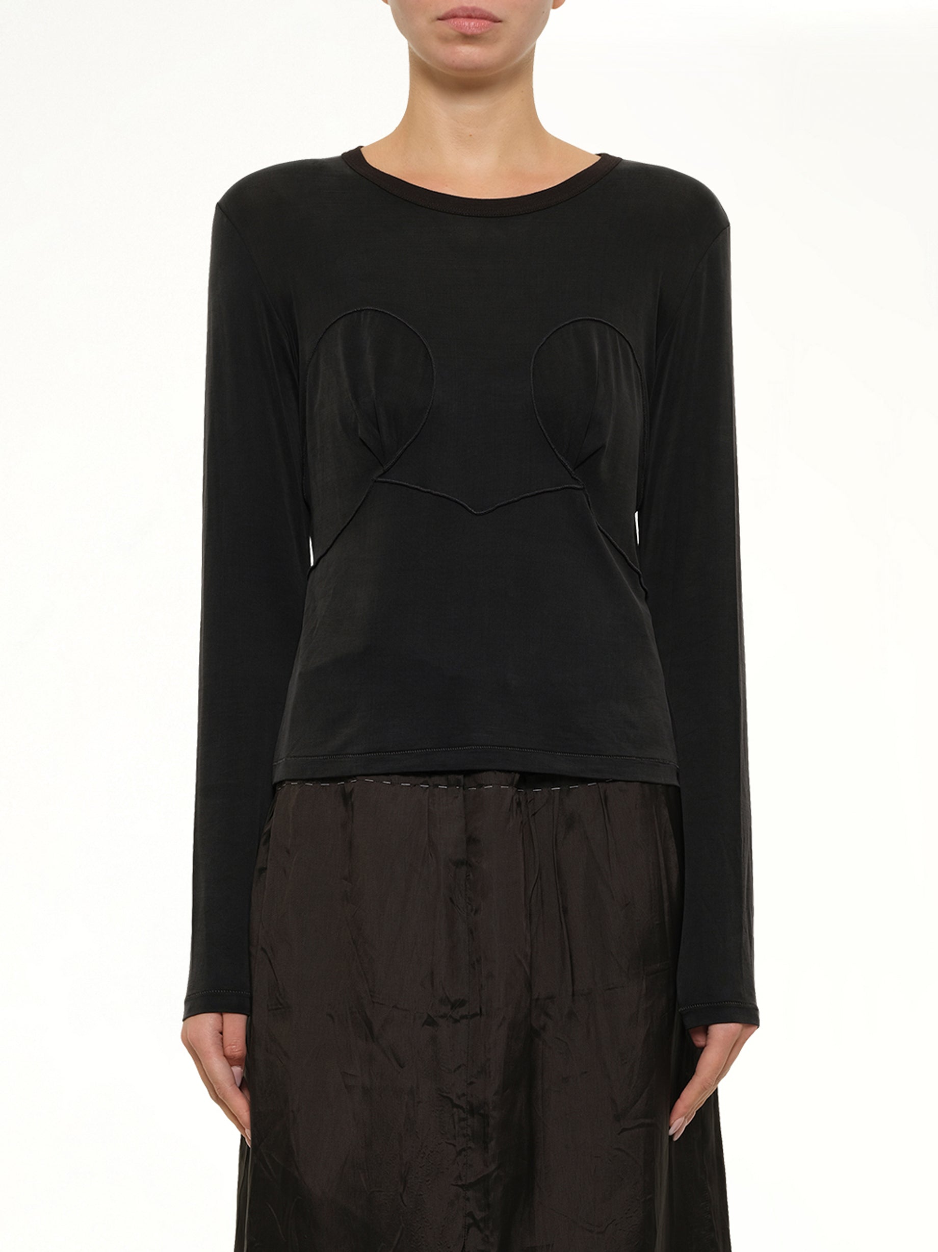 Image of a model wearing Tops. Product name - Cut-out Long Sleeve T-Shirt in Black colour by brand - MAISON MARGIELA