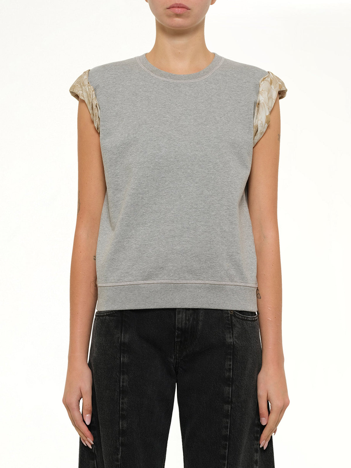 Image of a model wearing Outerwear. Product name - Exposed Lining Sweatshirt in Grey colour by brand - MAISON MARGIELA