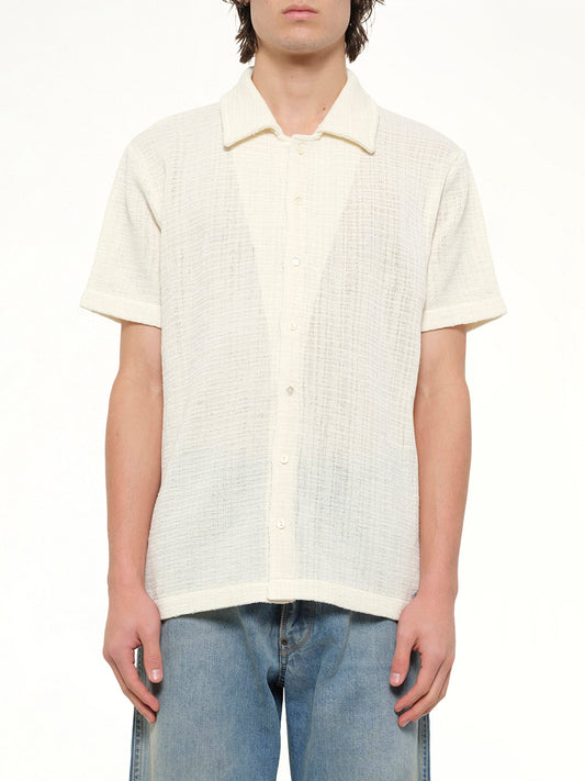 Image of a model wearing Tops. Product name - Linen Short Sleeve Shirt in White colour by brand - MAISON MARGIELA