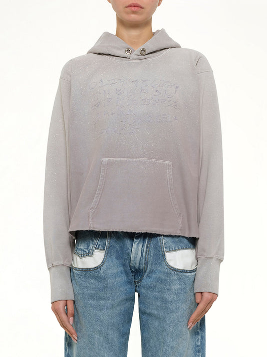Image of a model wearing Outerwear. Product name - Number Hoodie in Pink colour by brand - MAISON MARGIELA