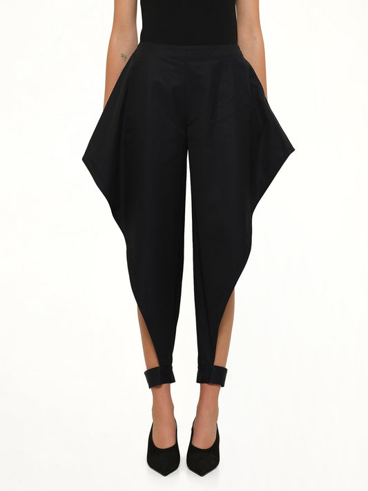 Image of a model wearing Pants. Product name - Pointed Pants in Navy colour by brand - ALAIA