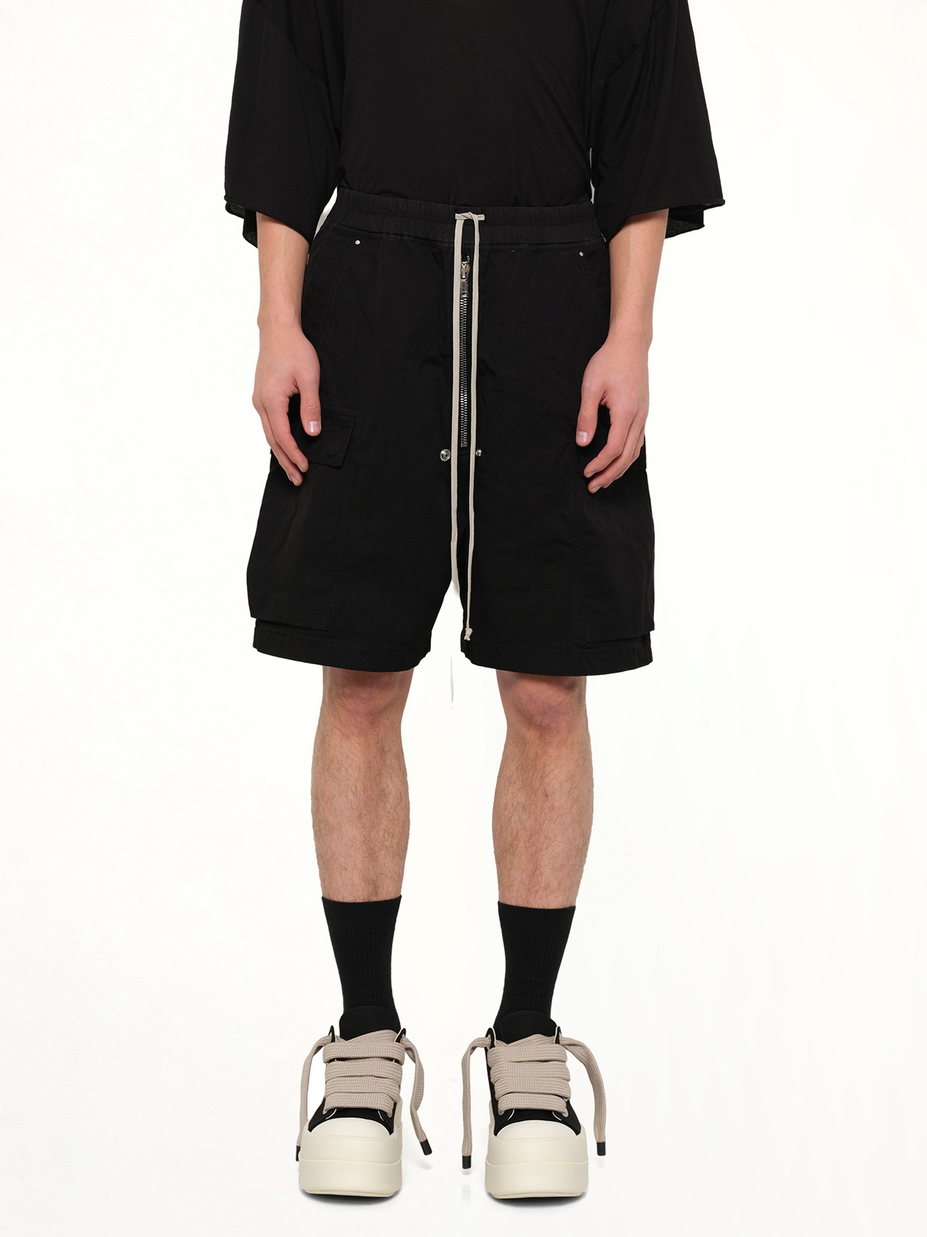 Image of a model wearing Shorts. Product name - Cargobela Shorts in Black colour by brand - RICK OWENS DRKSHDW