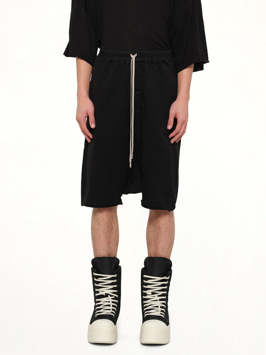 Image of a model wearing Shorts. Product name - Drawstring Pods in Black colour by brand - RICK OWENS DRKSHDW