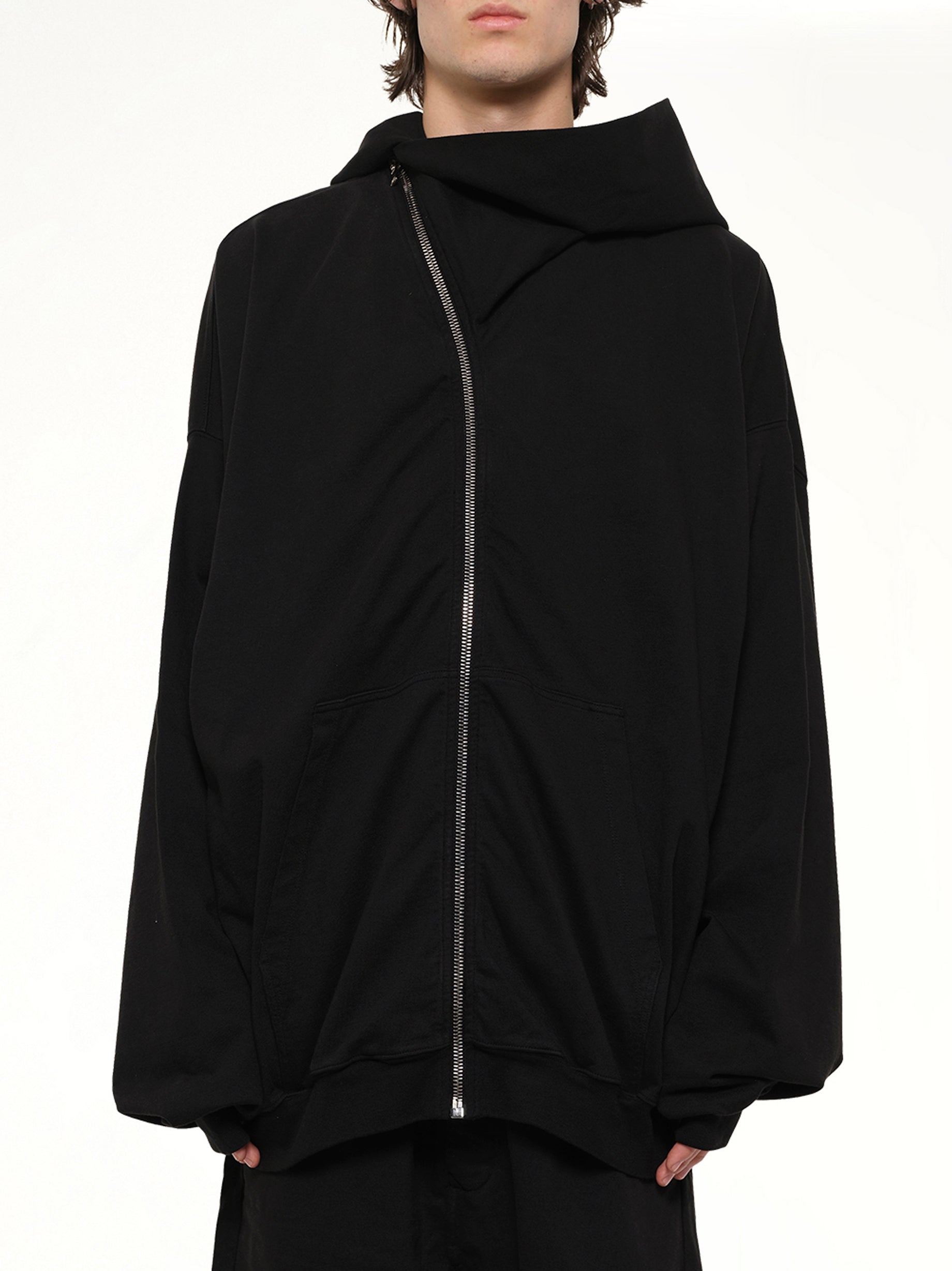 Image of a model wearing Outerwear. Product name - Mountain Hun Hoodie in Black colour by brand - RICK OWENS DRKSHDW