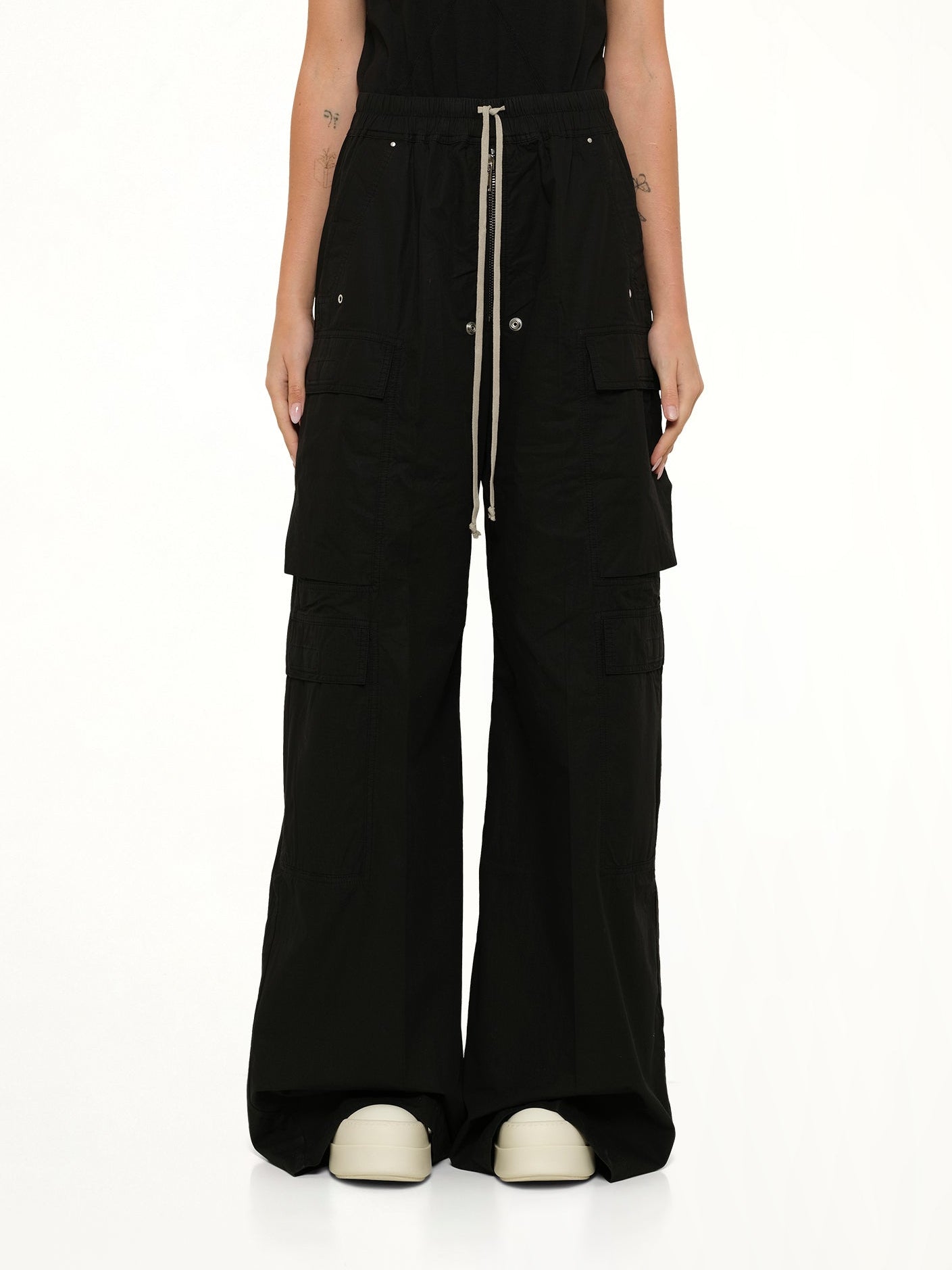 Image of a model wearing Pants. Product name - Double Cargo Jumbo Belas in Black colour by brand - RICK OWENS DRKSHDW