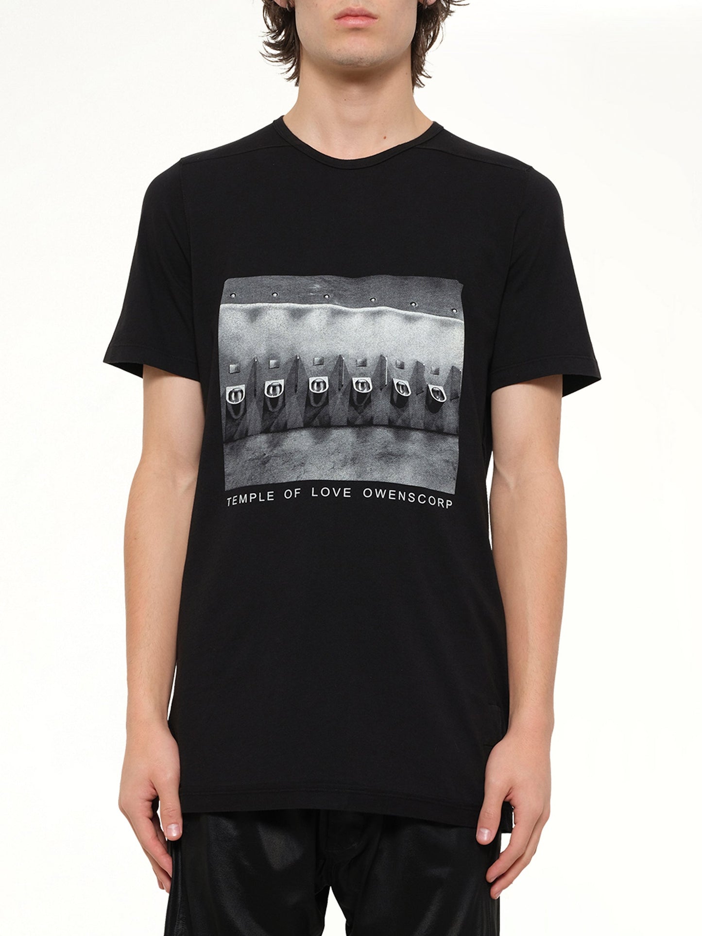 Image of a model wearing Tops. Product name - Urinal Level T in Black colour by brand - RICK OWENS DRKSHDW