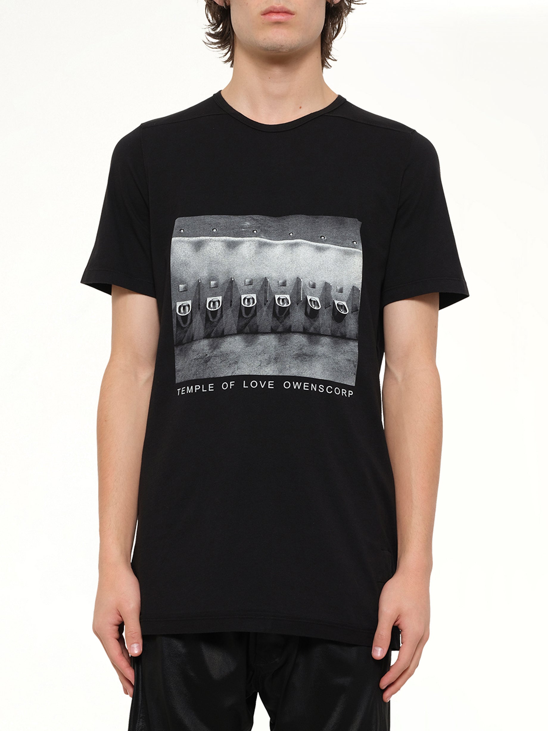 Image of a model wearing Tops. Product name - Urinal Level T in Black colour by brand - RICK OWENS DRKSHDW