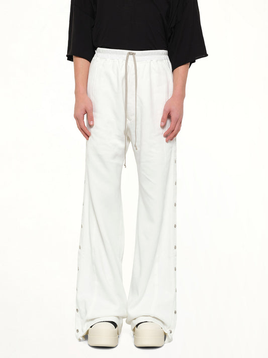 Image of a model wearing Pants. Product name - Wide Pusher Pants in White colour by brand - RICK OWENS DRKSHDW