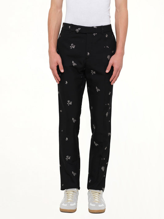 Image of a model wearing Pants. Product name - Fitted Pants in Black colour by brand - ALEXANDER MCQUEEN