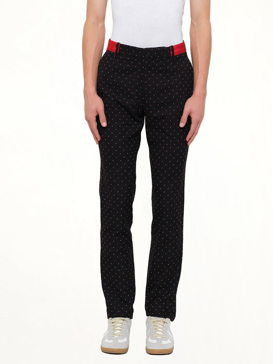 Image of a model wearing Pants. Product name - Jacquard Pants in Black colour by brand - ALEXANDER MCQUEEN