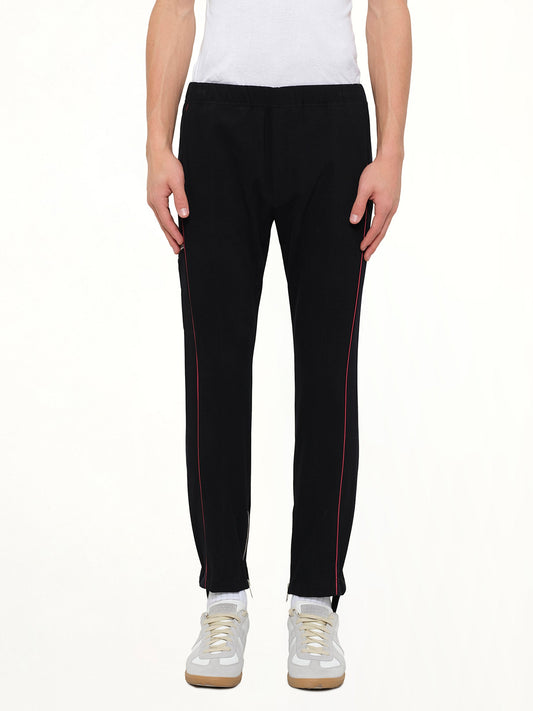 Image of a model wearing Pants. Product name - Jersey Pants in Black colour by brand - ALEXANDER MCQUEEN