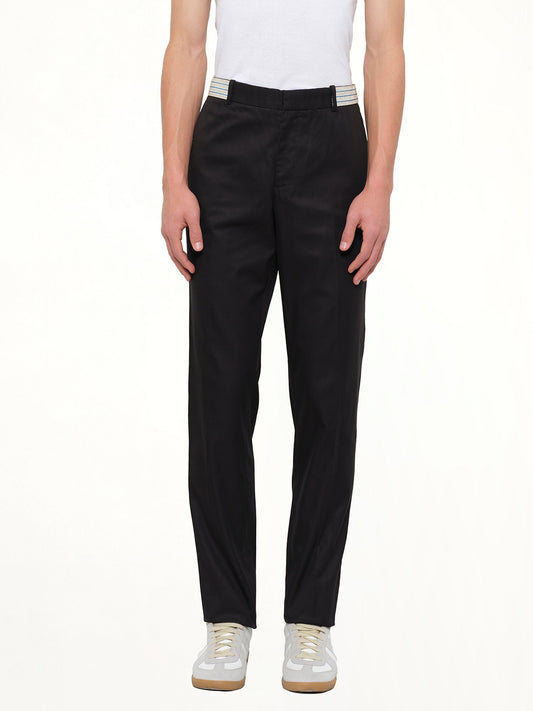 Image of a model wearing Pants. Product name - Pants in Black colour by brand - ALEXANDER MCQUEEN