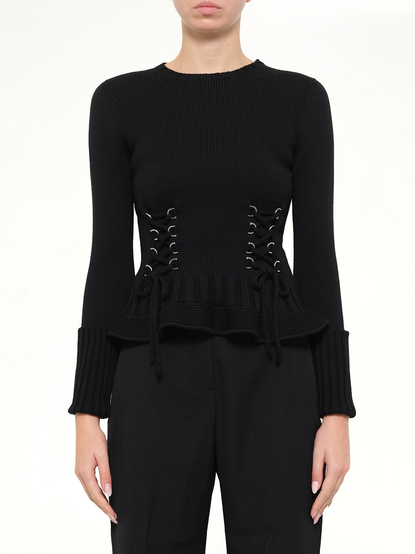 Image of a model wearing Outerwear. Product name - Lace Up Pullover in Black colour by brand - ALEXANDER MCQUEEN