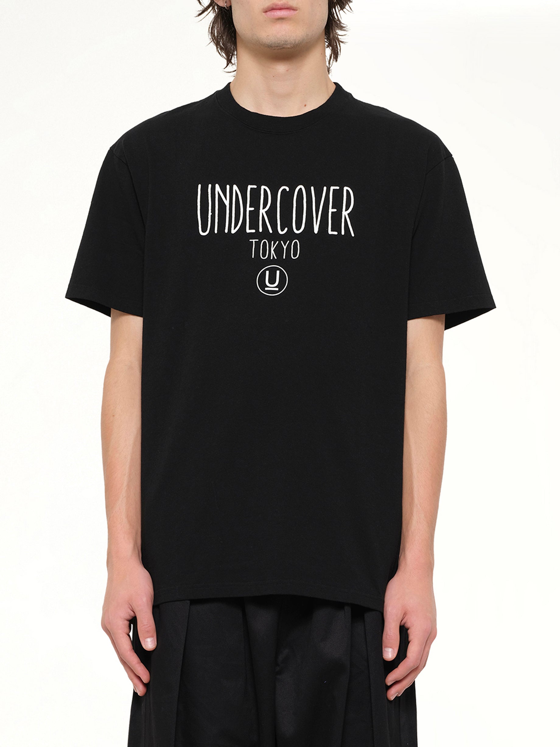 Image of T-Shirts. Product name - Undercover Tokyo T-Shirt in Black colour by brand - UNDERCOVER