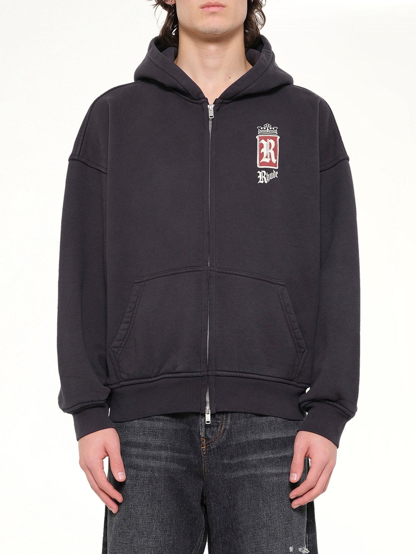 Image of a model wearing Outerwear. Product name - Rhude Fumar 91 Zip-Up Hoodie in Black colour by brand - RHUDE