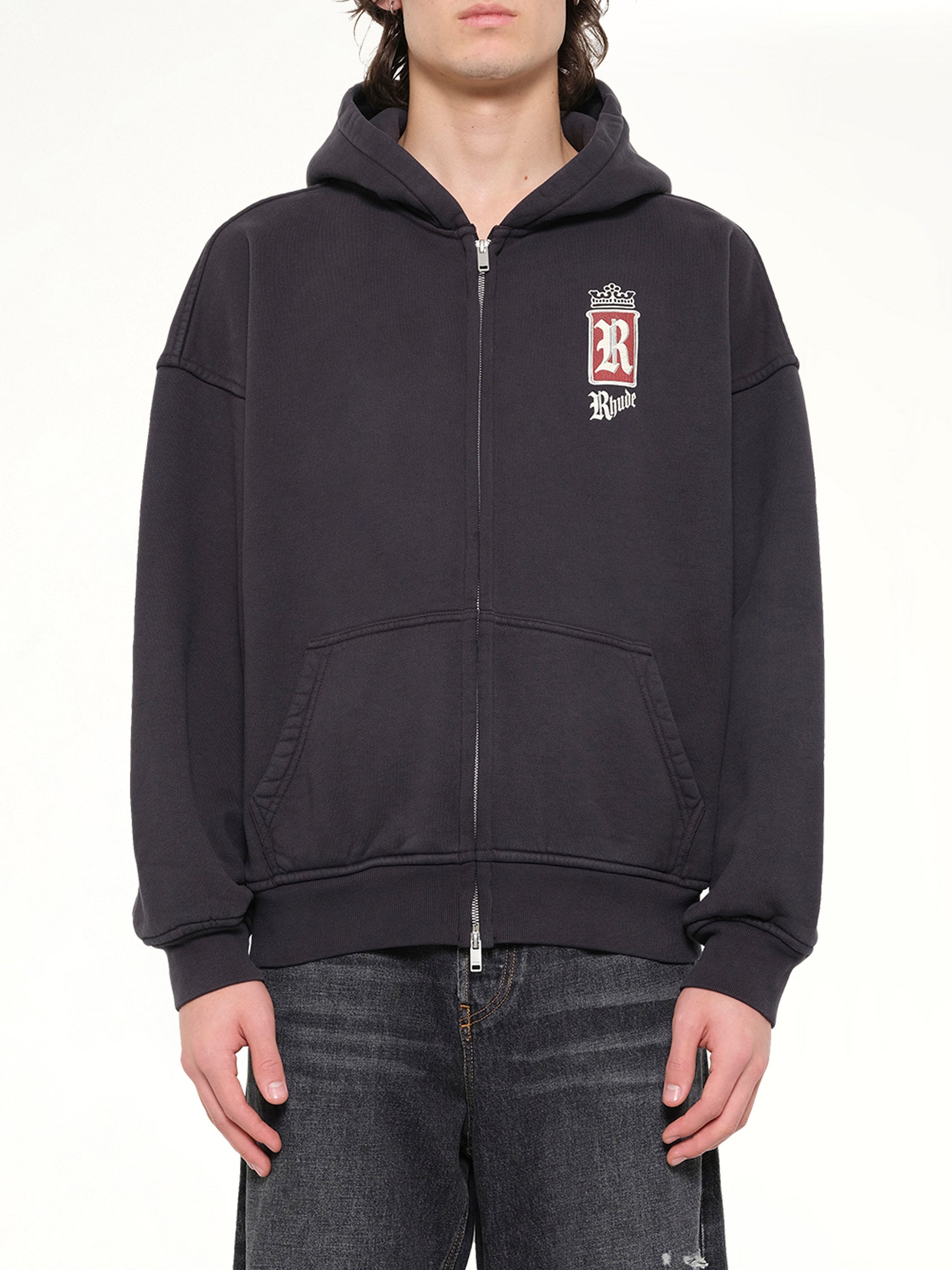 Image of a model wearing Outerwear. Product name - Rhude Fumar 91 Zip-Up Hoodie in Black colour by brand - RHUDE