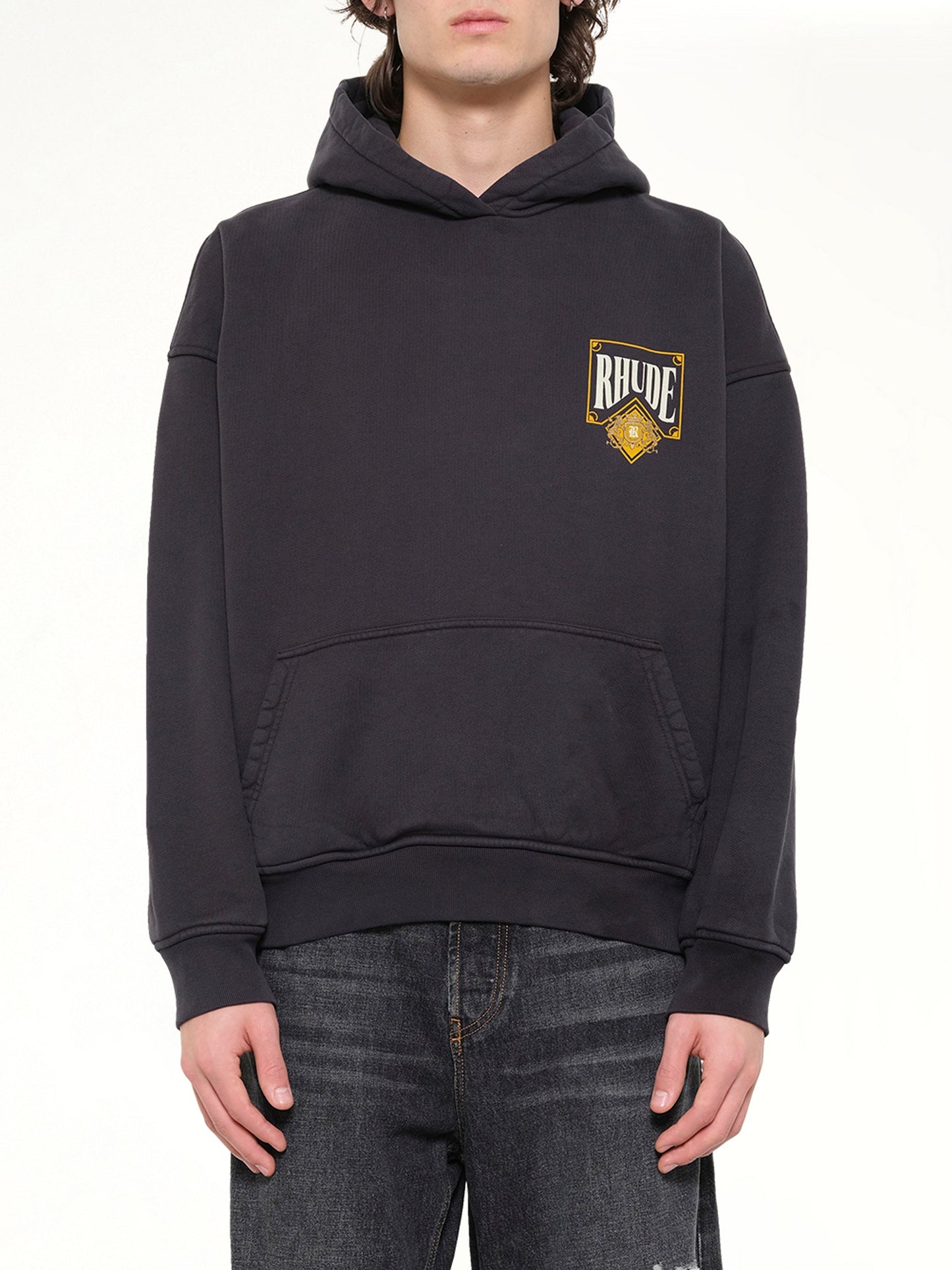 Image of a model wearing Outerwear. Product name - Rhude Playing Card Hoodie in Black colour by brand - RHUDE