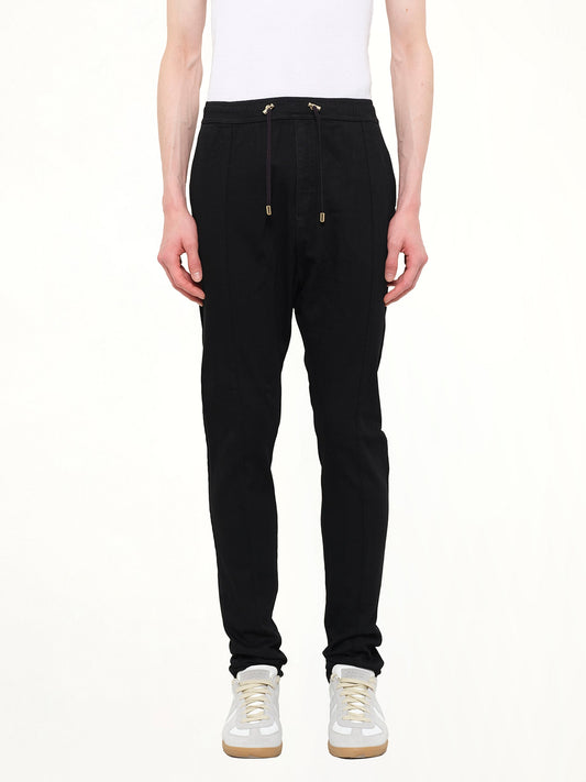 Image of a model wearing Pants. Product name - Casual Pant in 176 colour by brand - BALMAIN