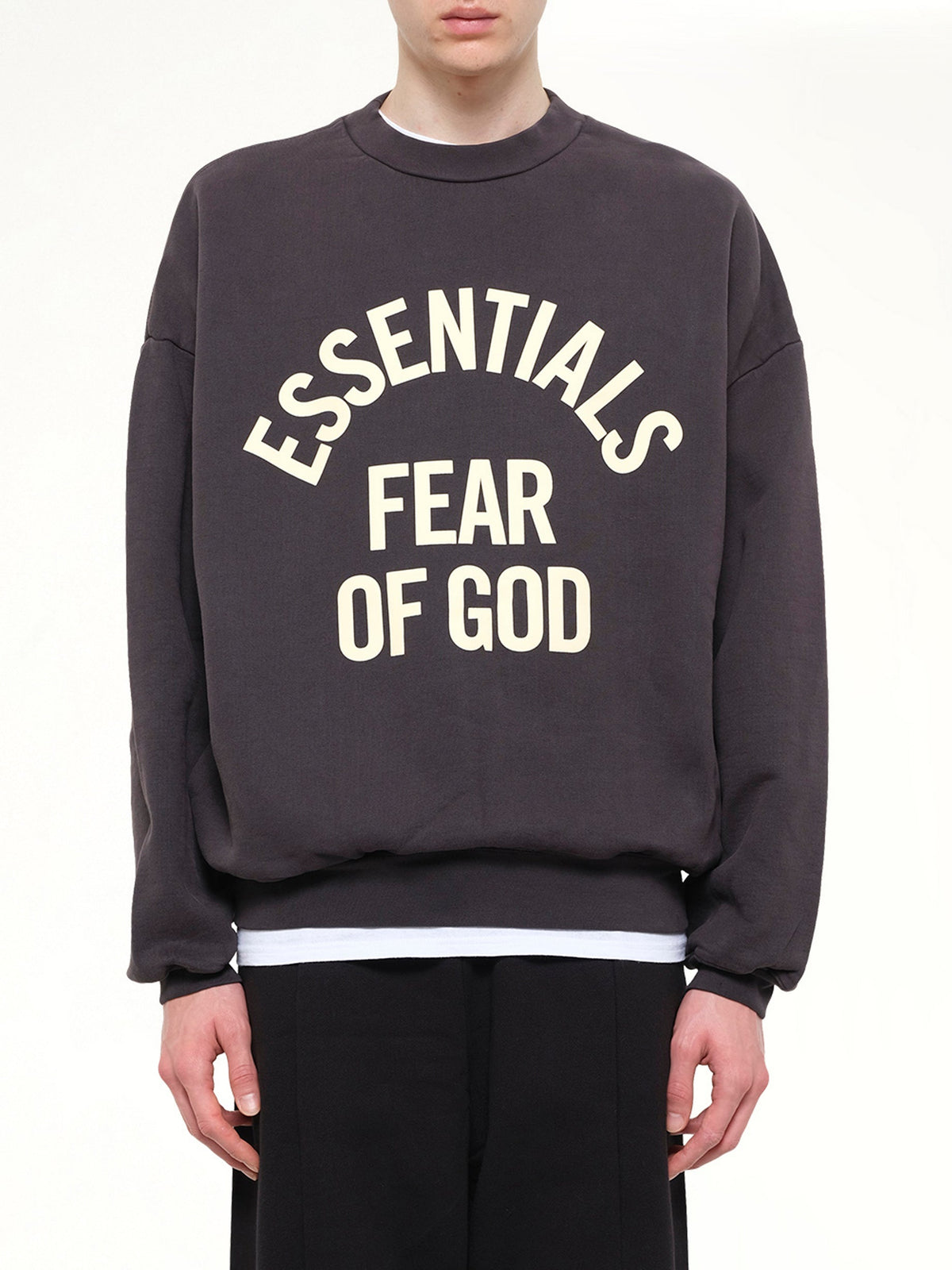 Image of a model wearing Outerwear. Product name - Campus 90's Crewneck Sweatshirt in Black colour by brand - FEAR OF GOD ESSENTIALS