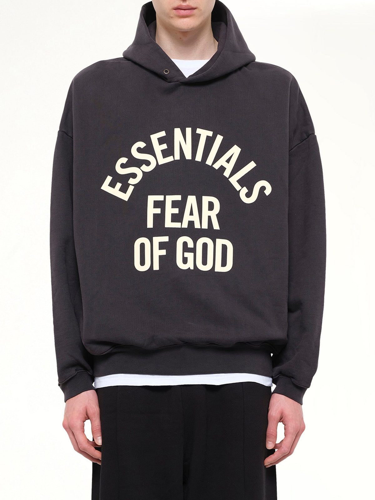 Image of a model wearing Outerwear. Product name - Campus 90's Hoodie in Black colour by brand - FEAR OF GOD ESSENTIALS