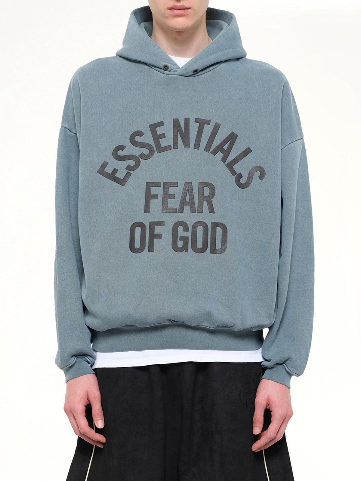 Image of a model wearing Outerwear. Product name - Campus 90's Hoodie in Blue colour by brand - FEAR OF GOD ESSENTIALS