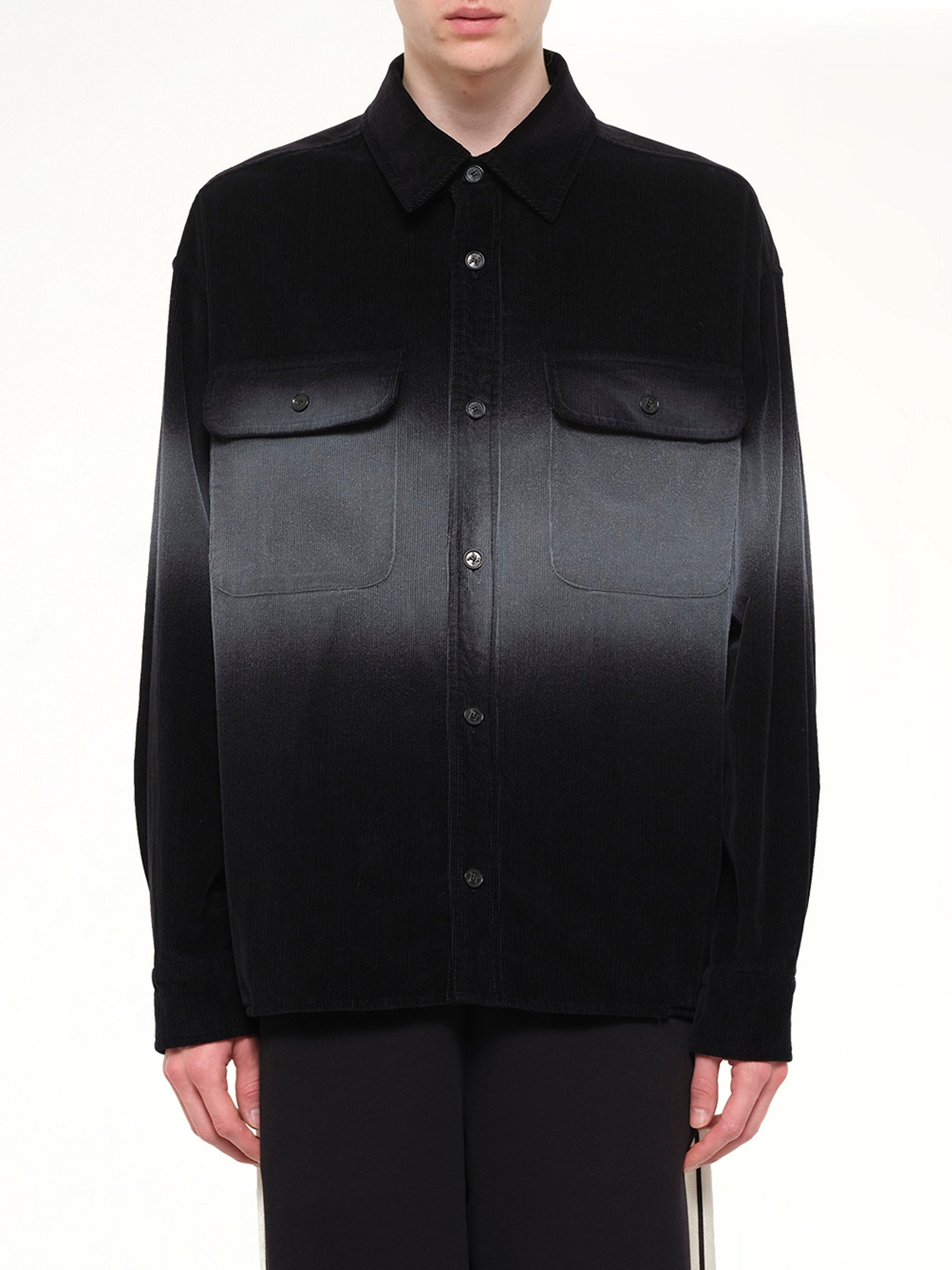 Image of a model wearing Tops. Product name - Faded Effect Classic Logo Loose Overshirt in Black colour by brand - PALM ANGELS