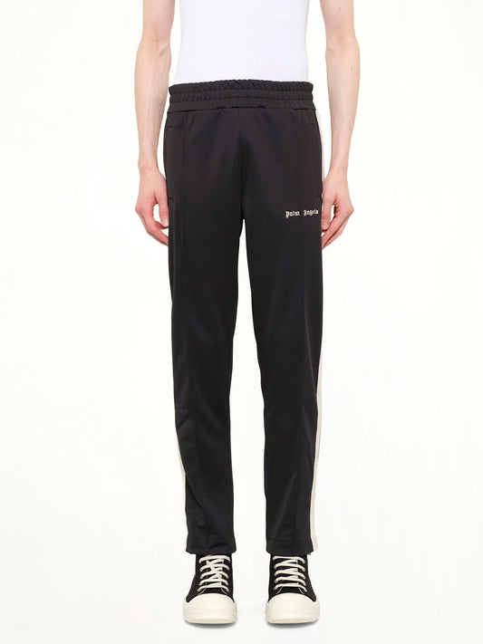 Image of a model wearing Pants. Product name - Classic Logo Track Pants in Black colour by brand - PALM ANGELS