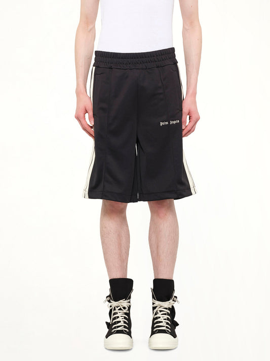 Image of a model wearing Shorts. Product name - Classic Logo Track Shorts in Black colour by brand - PALM ANGELS