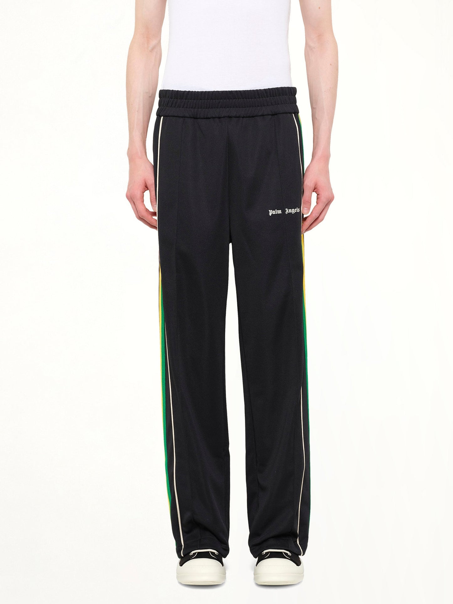 Image of a model wearing Pants. Product name - J Classic Logo Vint Track Pants in Black colour by brand - PALM ANGELS