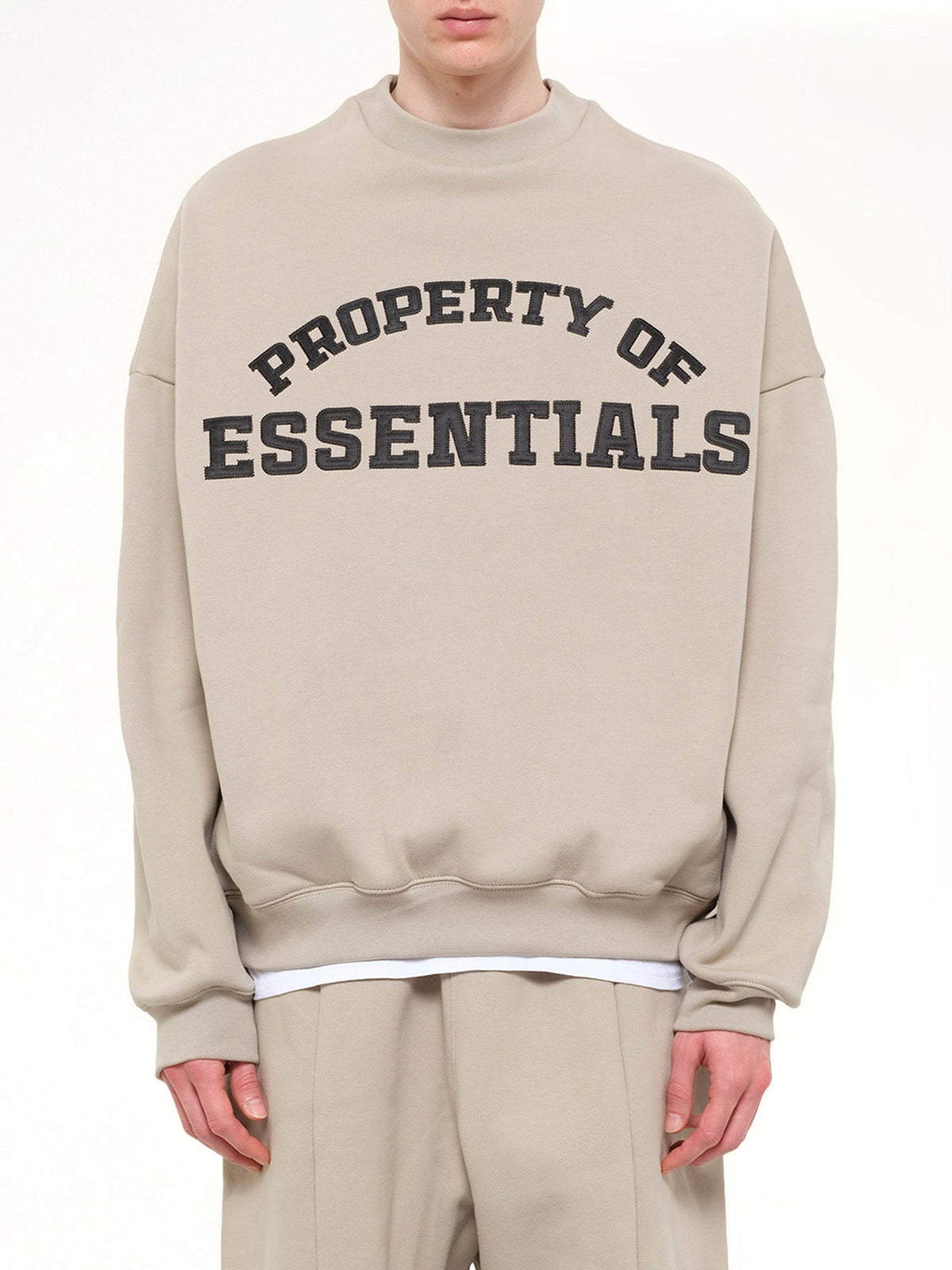 Image of a model wearing Outerwear. Product name - Property Lounge Crewneck Sweatshirt in Grey colour by brand - FEAR OF GOD ESSENTIALS