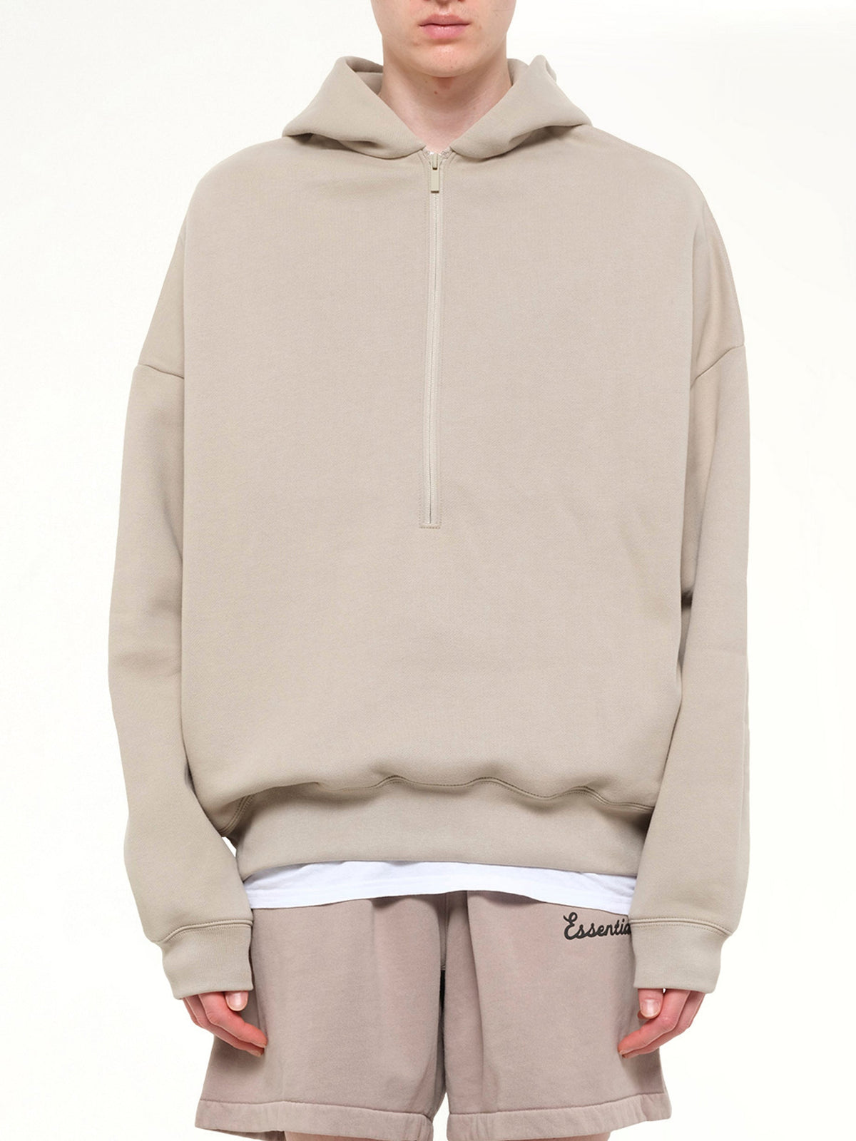 Image of a model wearing Outerwear. Product name - Property Lounge Half Zip Hoodie in Grey colour by brand - FEAR OF GOD ESSENTIALS