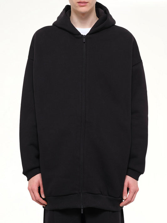 Image of a model wearing Outerwear. Product name - Property Lounge Long Zip Hoodie in Black colour by brand - FEAR OF GOD ESSENTIALS